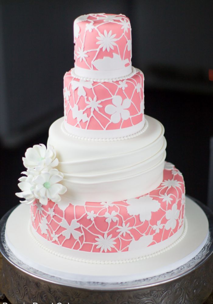 Pink Fondant Wedding Cake with White Floral Pattern Details and Sugar Flowers