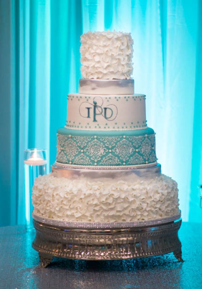 White and Teal Fondant Wedding Cake with Lace Details and Sculpted Fondant Frills