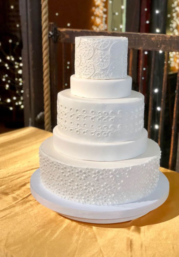 Pure White Wedding Cake with Sculpted Details